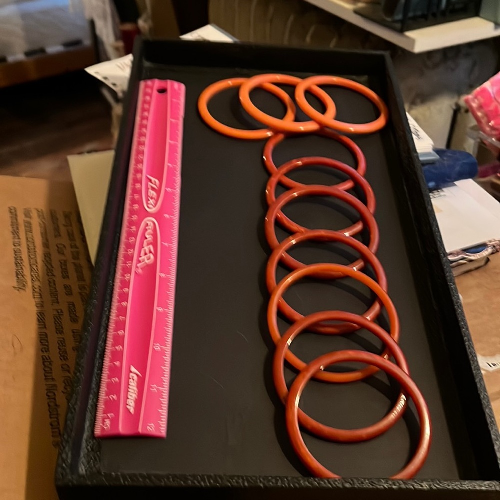 10 orange, burnt orange Bakelite Bracelets